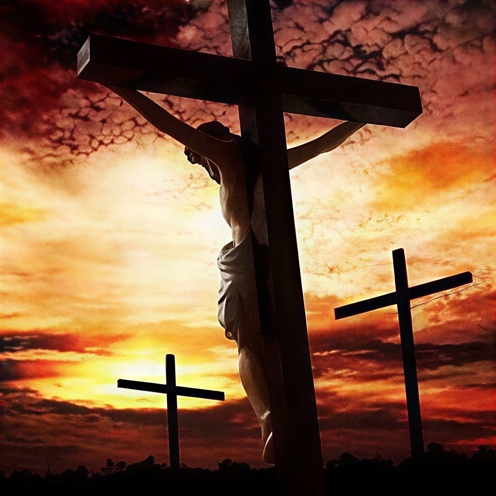 Crucifixion scene with dramatic sky