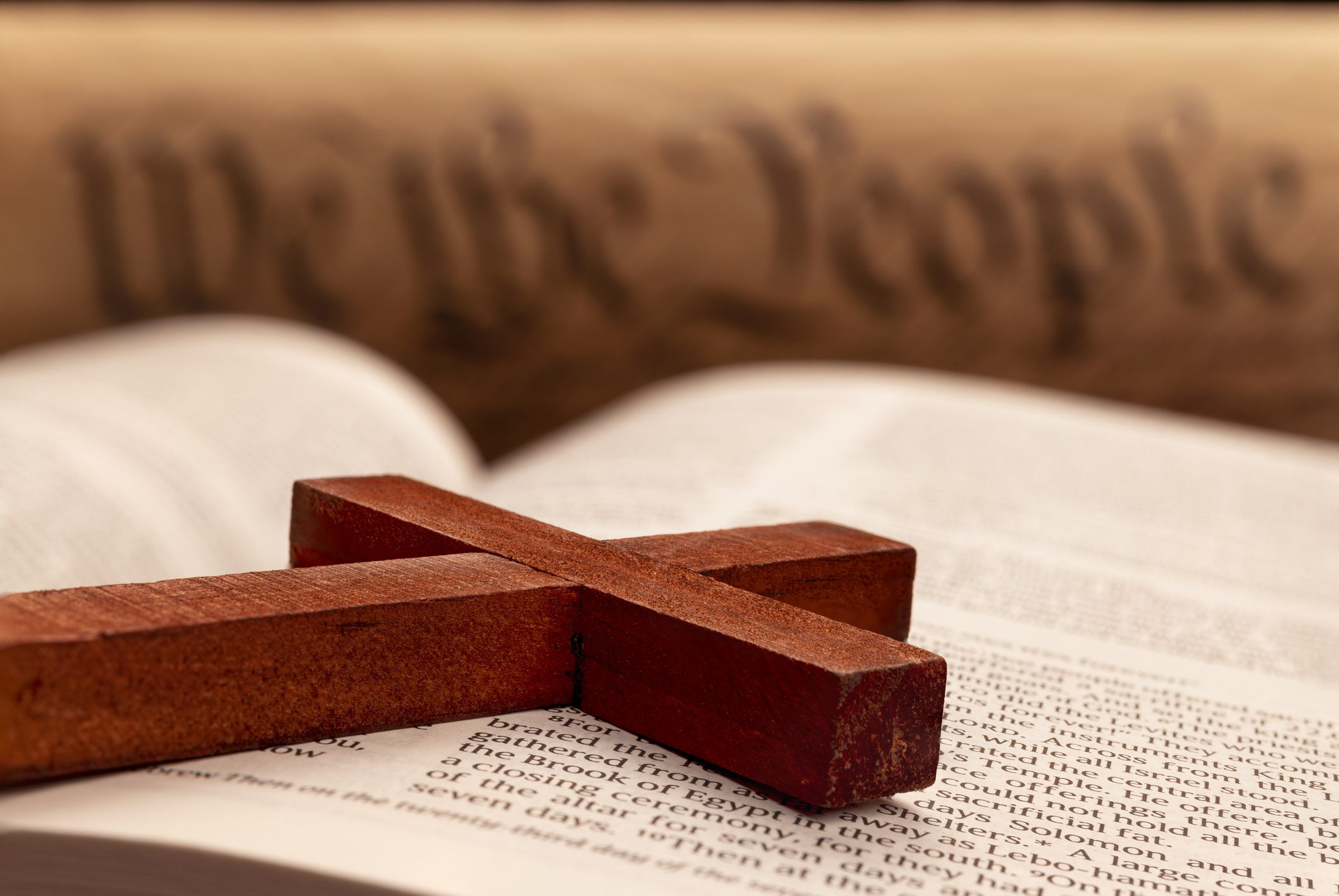Wooden cross on open book