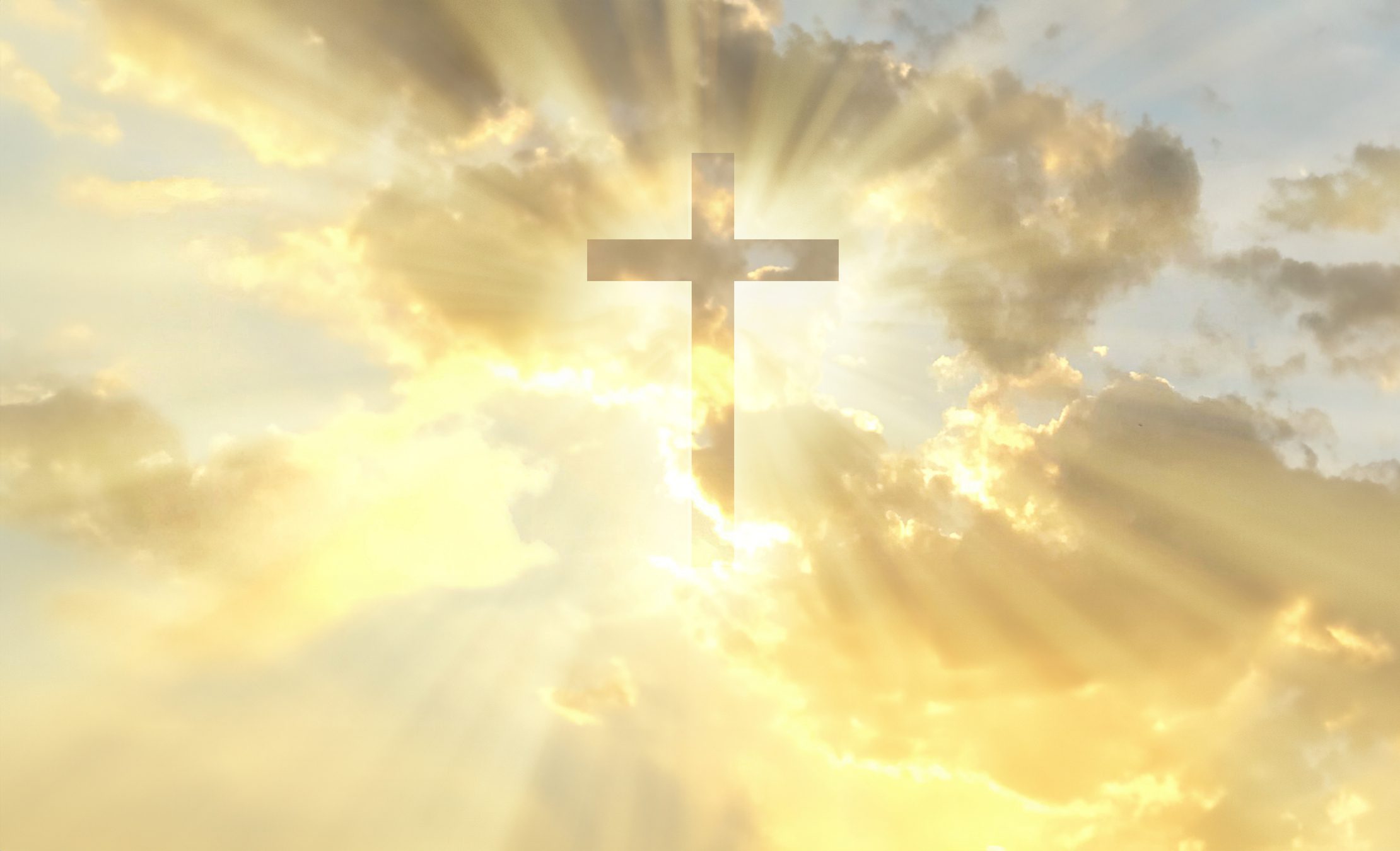 Radiant sky with a cross silhouette