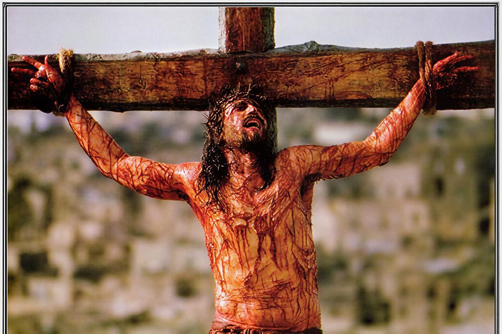 Historical crucifixion depiction, distressed figure